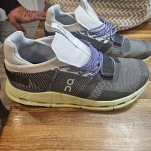 On Running Shoes with Purple and White Details